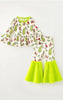 CHRISTMAS  PRINTED ON WHITE AND LIME GREEN FAUX FUR BELL BOTTOMS.