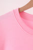 Pink football sequin mom&me top