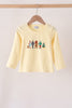Beige character embroidery top