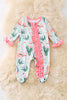 Cactus printed baby onesie with ruffle trim.