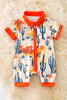WESTERN) DRY DESSERT ON CREAM PRINTED BABY ROMPER WITH ORANGE TRIM.