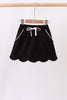 Black scallop hem bow skort