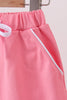 Deep pink scallop hem bow skort
