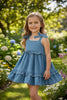 LT. BLUE DENIM DRESS WITH RUFFLE DETAIL.