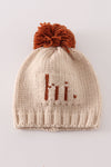 Beige pompom hi cable beanie