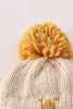 Beige pompom bee cable beanie