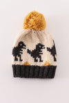 Black pompom dinosaur cable beanie