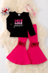 LOVE LIKE JESUS" BLACK LONG SLEEVE TOP & FUCHSIA BELL BOTTOMS.