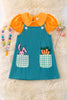 TEAL EASTER OVERALL DRESS WITH ORANGE BUBBLE SHIRT.