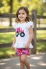 PINK TRACTOR PRINTED ON WHITE RUFFLE TOP AND PINK SHORTS.