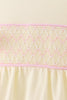 Cream smocked bow bubble
