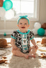 Cow Printed Baby Romper with Aqua Ruffle Hem